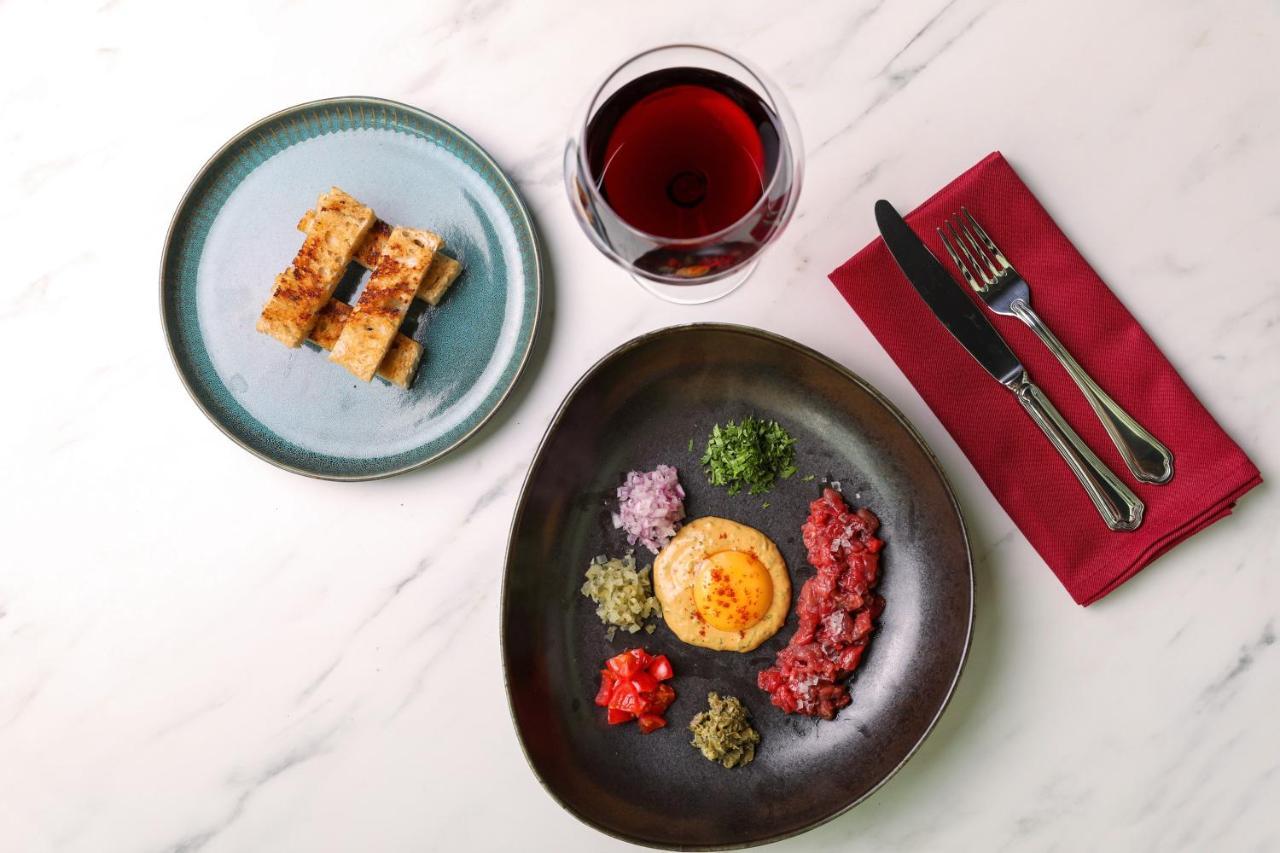 Wish More Hotel Sisli Κωνσταντινούπολη Εξωτερικό φωτογραφία A meal of octopus and potato